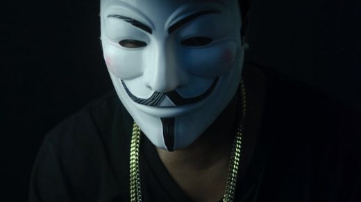photo of person wearing guy fawkes mask