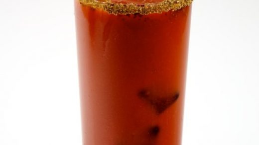 Bloody Mary Coctail With Celery Stalk And Pitcher.